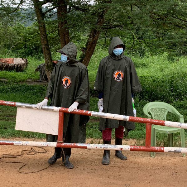 Virunga Park Rangers manning a checkpoint to screen  for ebola.  Over 1,000 people per day pass through this checkpoint near Beni, the site of an existing Ebola outbreak.    Photo was taken Dec 2019. (Photo courtesy of Virunga National Park)