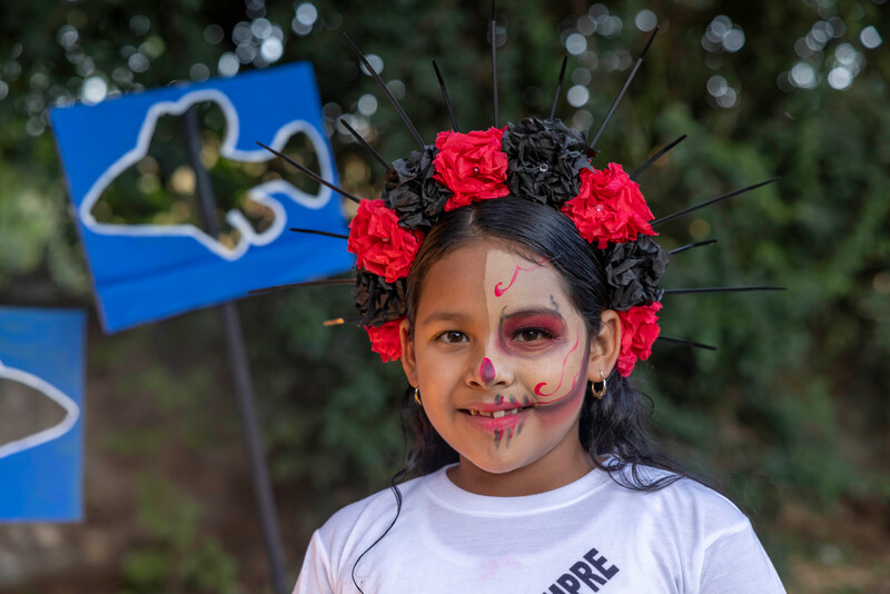 Local children help release golden skiffia during Day of the Dead celebrations (Photo by Manfred Meiners/Re:wild)