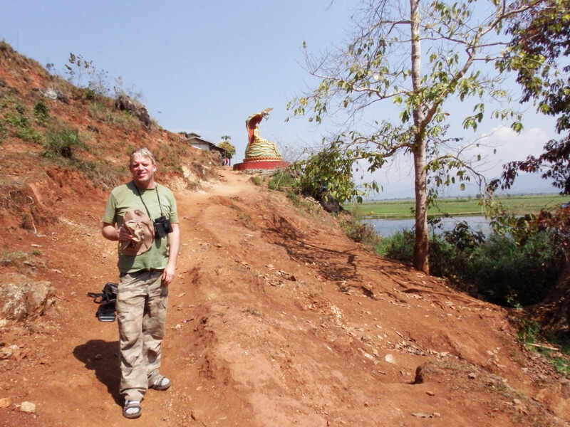 Richard Thorns above the Indawgyi River as it outflows from Indawgyi lake in the dry season. (Photo courtesy of Richard Thorns) .