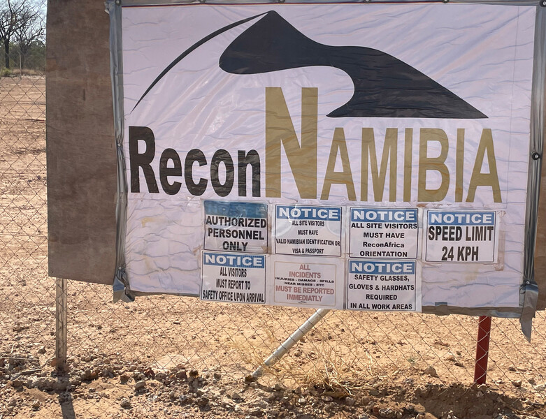 Signs at Kawe drill site. For now it appears that drilling is over at the two main drilling sites at Kawe and Mbambi in Kavango East region of Namibia. The rig is on a truck loaded to move from Mbambi, and at Kawe it seems the main drill pond has been filled in. (Photo by Re:wild)