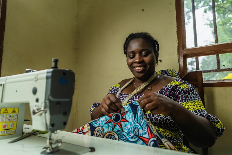 Masika Sakina Salambongo working in the Rumangabo Sewing Workshop. 