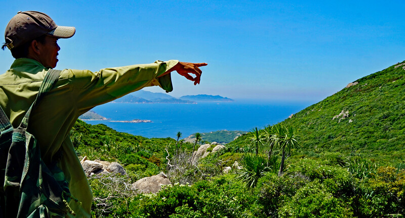 Ranger in Nui Chua (Vietnam) with dry forest in background (Photo by Andrew Tilker, Re:wild)
