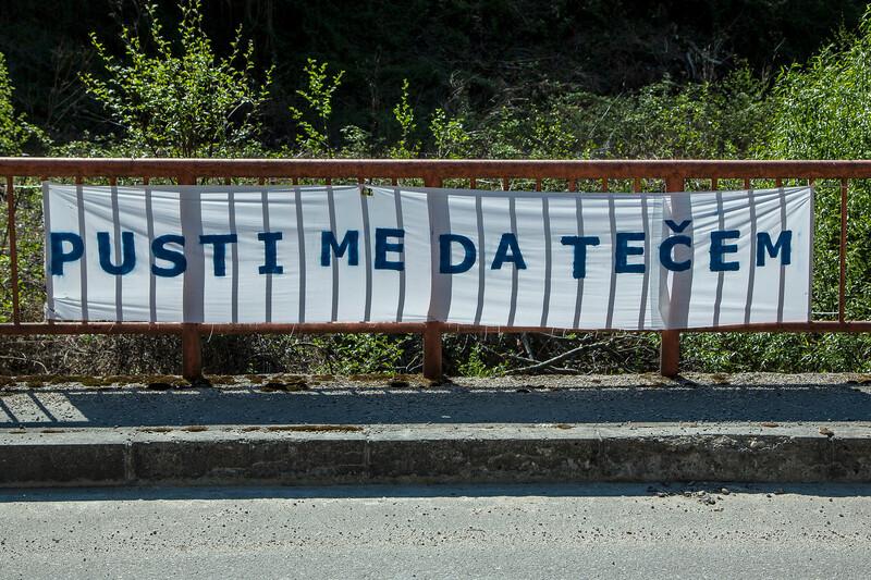 Sign on the Neretvica River that says 